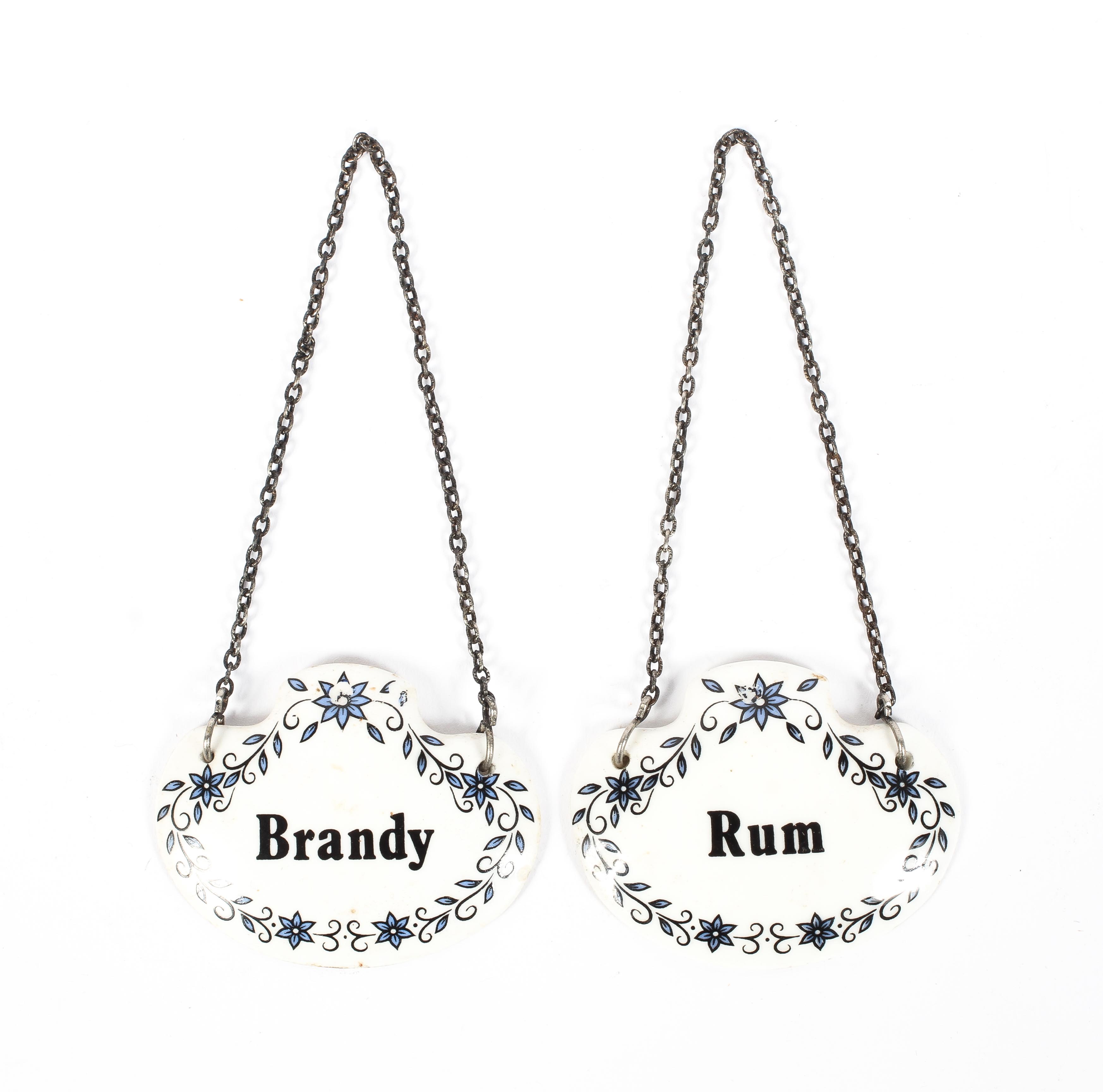 A pair of Sheer Elegance bone china spirit decanter labels, comprising: Rum and Brandy,