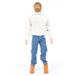 A vintage Action Man with blond hair and beard, in a roll neck sweater, jeans and boots,