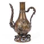 A bronze ewer of Turkish shape, 20th century, cast with branch handle and spout,