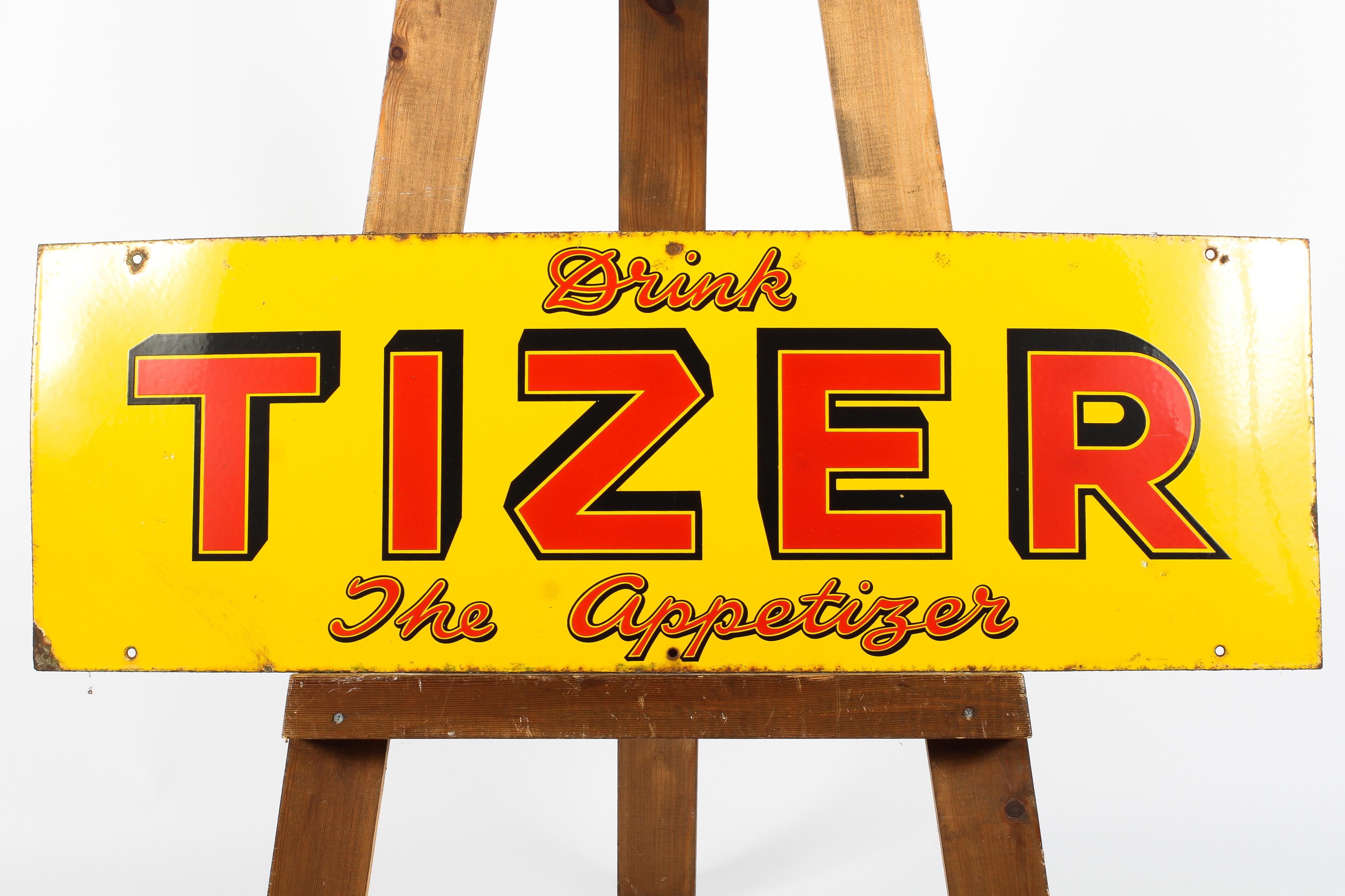 A vintage Tizer enamelled advertising sign, circa 1940, of rectangular form,