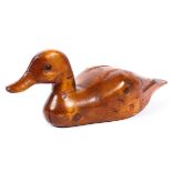 A hand carved wooden decoy duck,