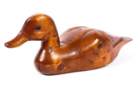 A hand carved wooden decoy duck,