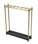 A Victorian brass stick stand, with waisted finials and six brass divisions to top,