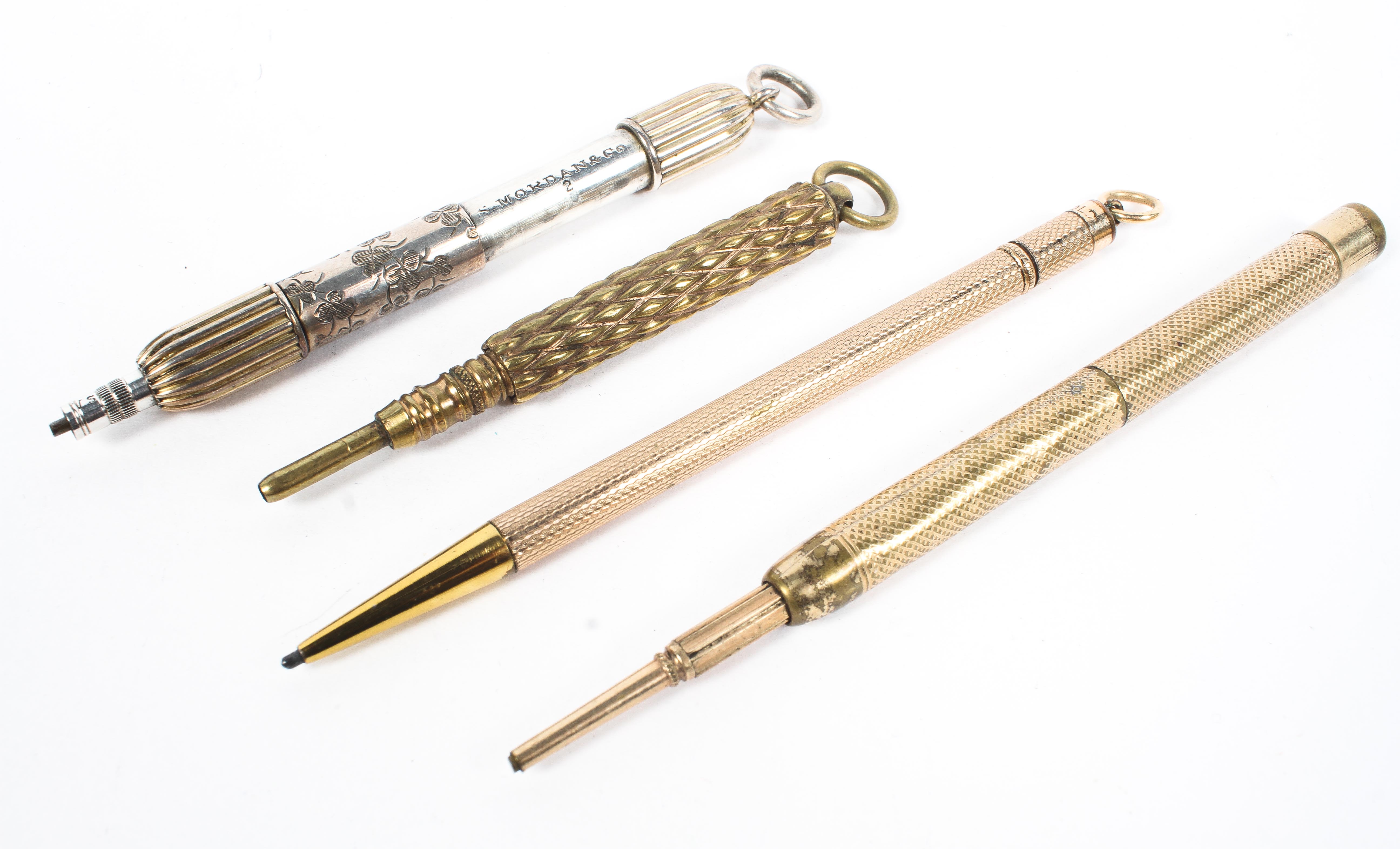 Four yellow and white metal propelling pencils, two with engine turned decoration to the handles, - Image 2 of 4