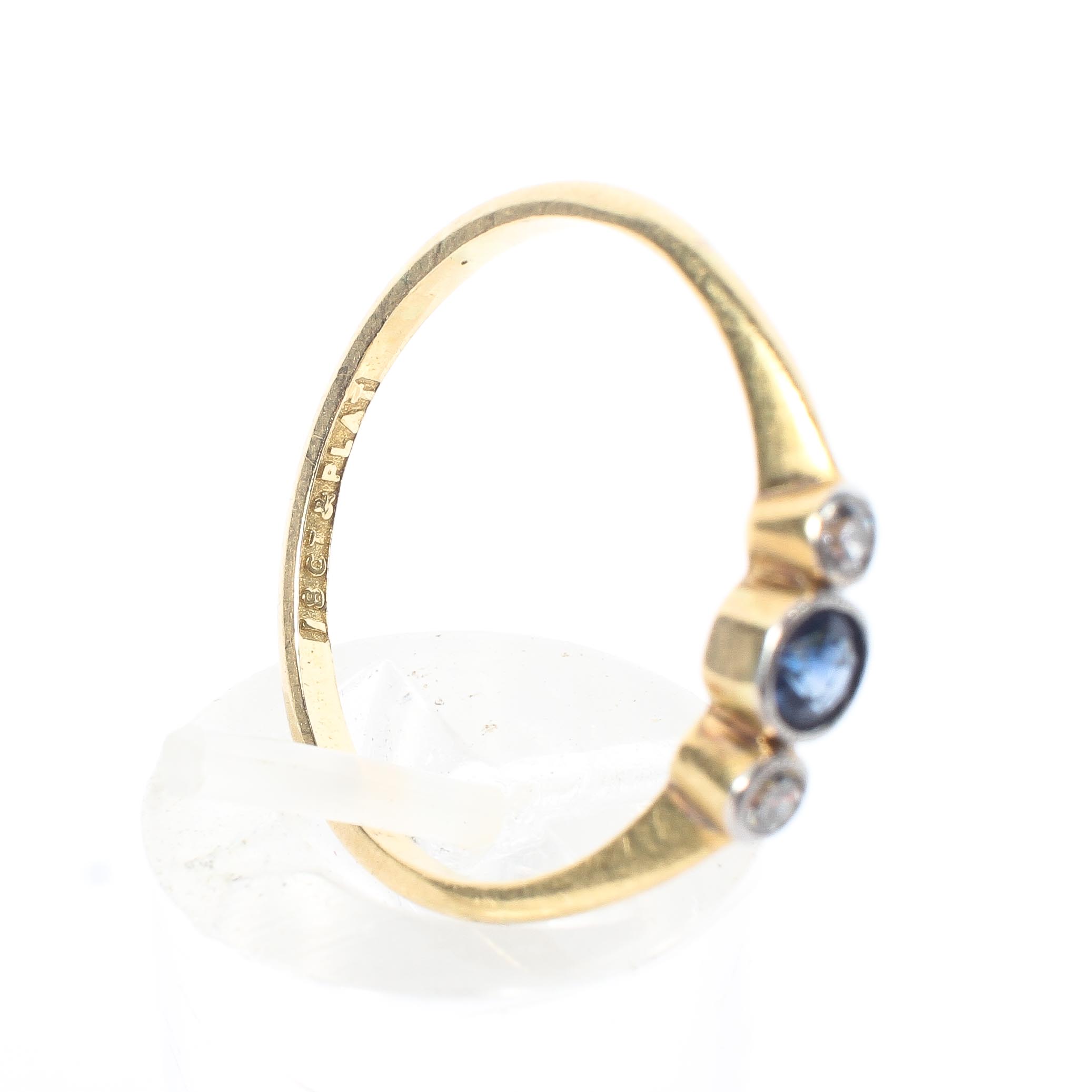 An 18ct gold sapphire and diamond ring, central round cut sapphire with single cut diamond accents. - Image 4 of 5