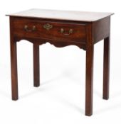 A Georgian mahogany side table, with frieze drawer and scroll apron, on chamfered square legs,