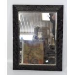 A large early 20th century bevelled edge wall mirror, of rectangular form,