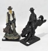 A cast metal sculpture of a cowboy riding a horse together with a similar plaster sculpture