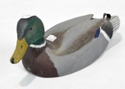 A contemporary painted wooden sculpture of a mallard duck,