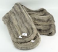 A vintage lined stole of grey-beige fur,