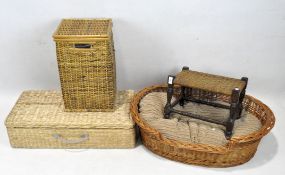 Two wicker baskets together with a wooden framed stool and a large wicker dog bed.