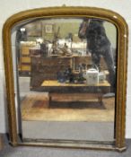 A 20th century over mantle mirror, of arched form,
