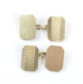 A pair of gents 9ct gold cufflinks, with one part having engine turned decoration, the other plain,