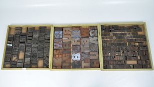 Three sets of 1920s to 1930s wooden printing blocks, featuring letters and numbers of various sizes,