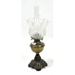A Victorian brass oil lamp together with a fluted edge pattenated glass shade