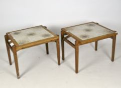 A pair of Retro tile topped teak occasional tables, on pegged tapering supports,