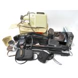 A collection of cameras, lenses and accessories,