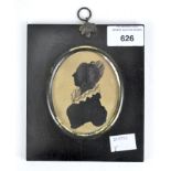 A late 19th/early 20th Century portrait miniture, featuring the profile of a woman, of oval form,