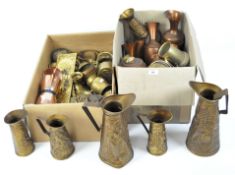 An assortment of brassware, including a pair of pressed brass jugs, a brass tankard,
