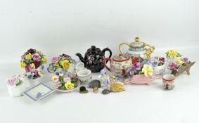 Eleven ceramic flower posies, together with three teapots, a Wedgwood dish and other items