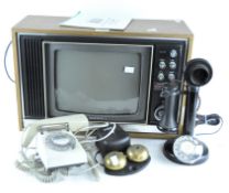 A vintage Sony Trinitron television, together with two telephones and a bell