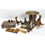 A collection of treen, including a carved box, tripod table and an minature elephant,