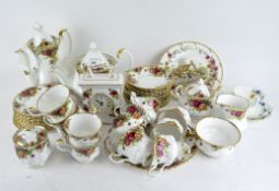 A Royal Albert 'Old Country Roses' part tea service, including cups and saucers, milk jug, teapot,
