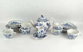 A Meissen style blue and white part tea service, including a teapot, cups and saucers and plates,