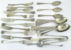 An assortment of silver plated flatware, comprising spoons, forks, sugar tongs and more,