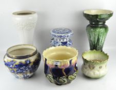 Three glazed ceramic jardiniere stands, together with three jardinieres,