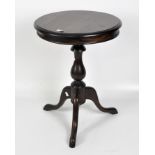 A round mahogany occasional table on a turned pedestal and splayed tripod foot,