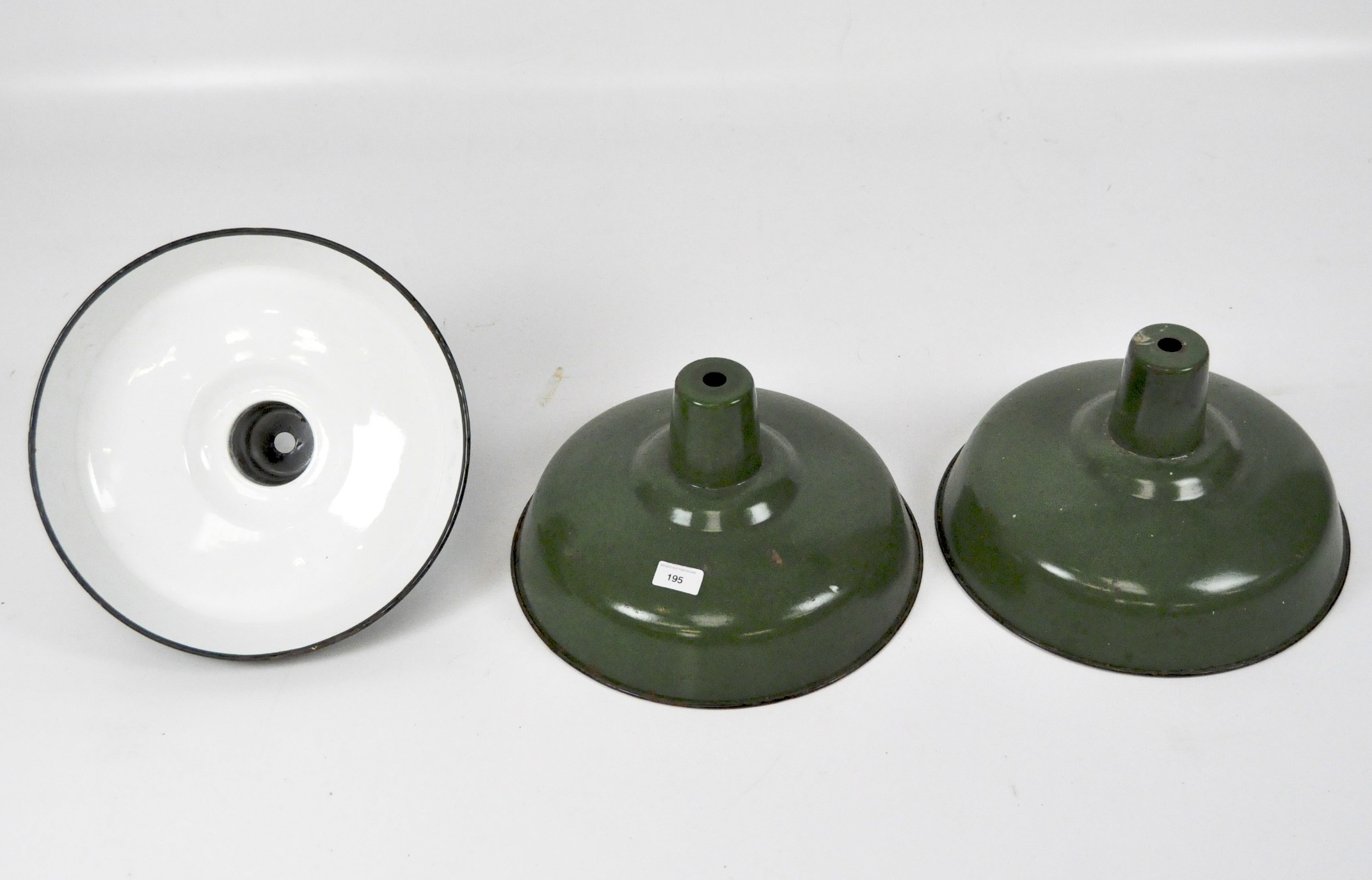 Three retro green enamel hanging light shades,