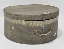 A vintage hat box, of circular form, with leatherette finish and a carry handle and lock,