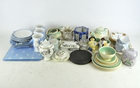 A Susie Cooper part tea service including a teapot, cups, saucers, jug and serving plates,