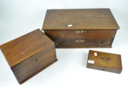 Three antique wooden boxes, the largest one with a fitted interior and lower tray,