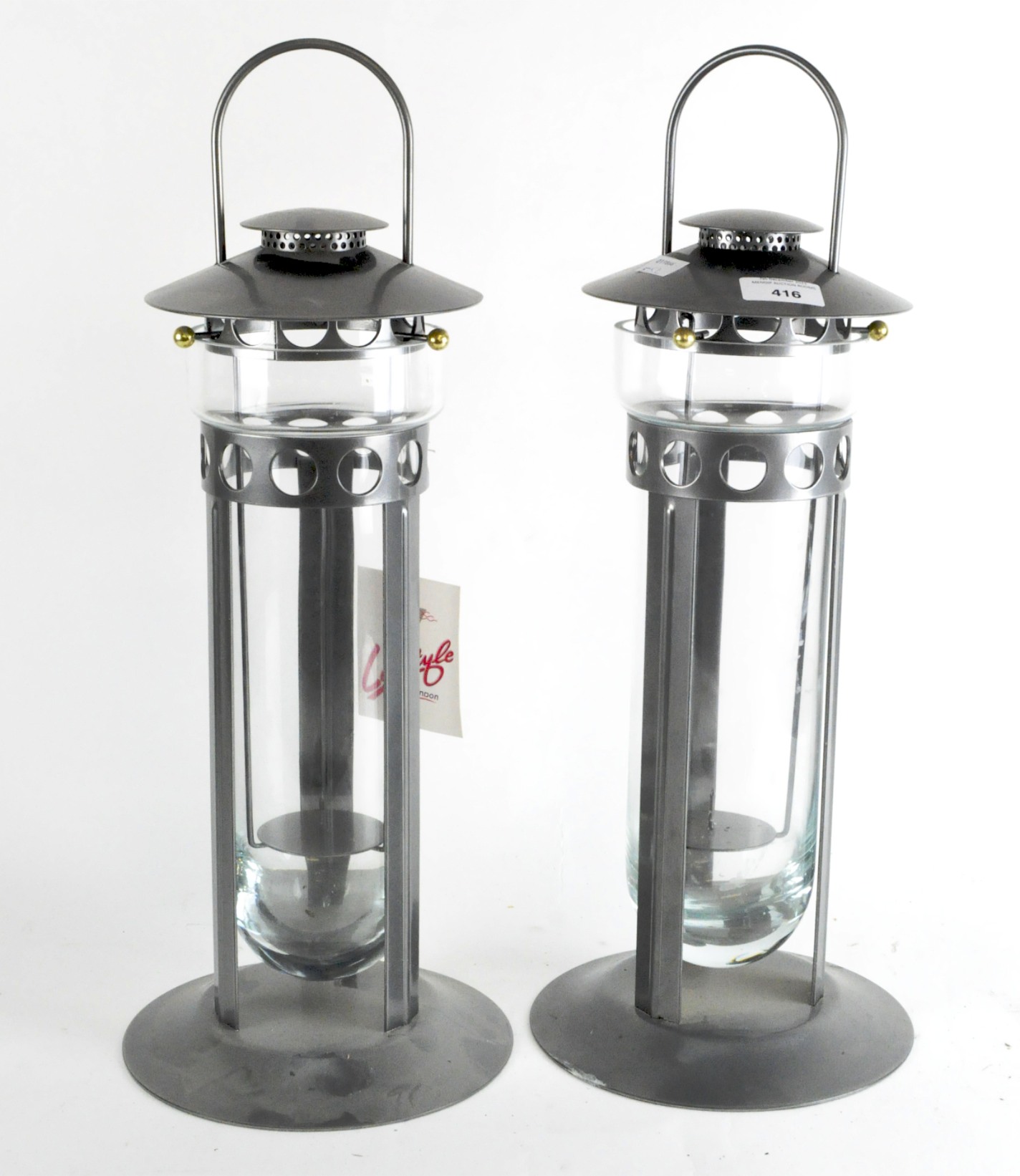 Two modern metal and glass candle lanterns,