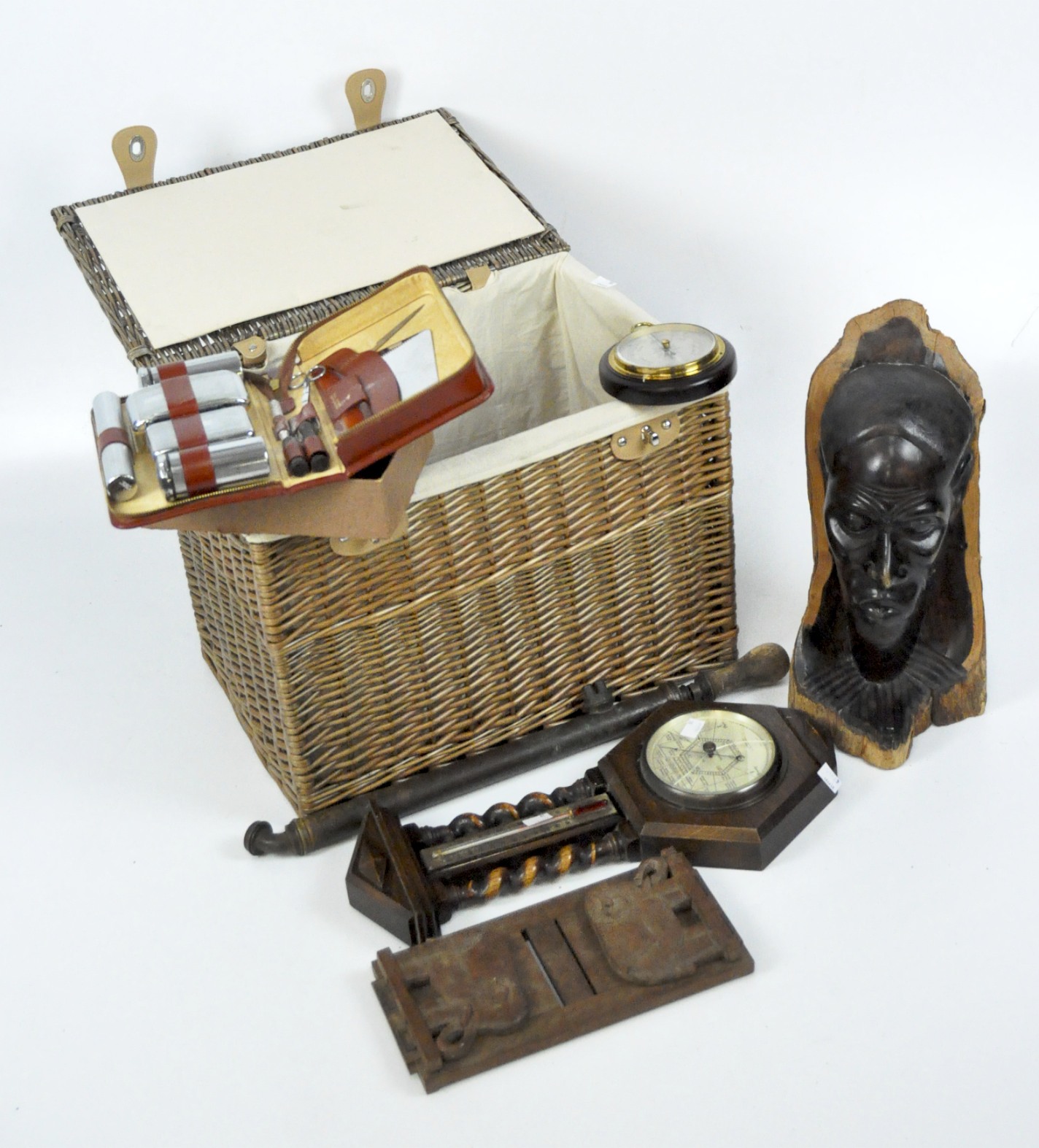 An assortment of collectables, including a barometer,