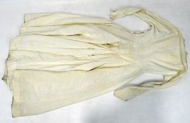 A early 20th century wedding dress, ivory with buttons and long sleeves.