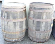 Two coopered wooden barrels,