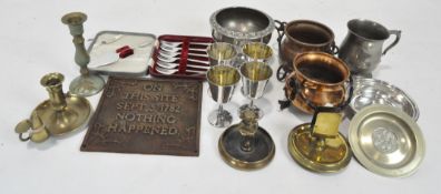 A collection of metalware, including a cast metal sign