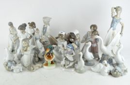 A collection of Lladro and Nao figures, including geese,