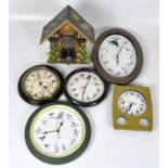 A selection of contemporary wall clocks, battery powered,