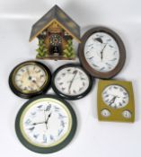 A selection of contemporary wall clocks, battery powered,