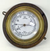 An early 20th century wall barometer, circular in form,