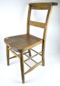 An late 19th/early 20th century wooden chapel chair, with turned and tapered supports, height 82cm.