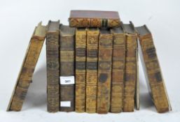 A selection of antique leather bound books,
