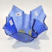 A mid 20th century blue glass handkerchief vase with textured decoration, height 18cm,