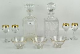 Two 20th century moulded glass decanters with stoppers, height 26.