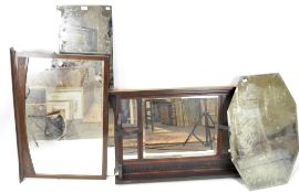A 20th century over mantle mirror together with three other mirrors and a metal travelling trunk