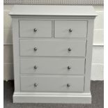 A contemporary grey chest of drawers with two over three drawers with metal handles,
